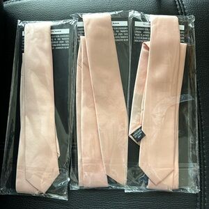 3 brand new peach 2 inch skinny ties in original packaging.